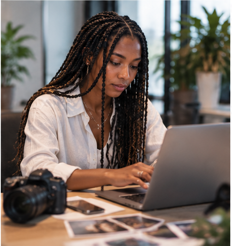 Creative working with a laptop and camera