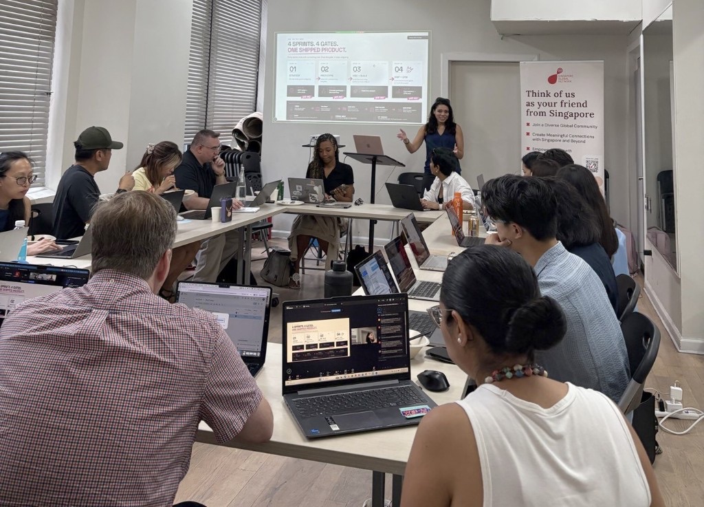 Adults building together in an AI Founder Playbook classroom in New York